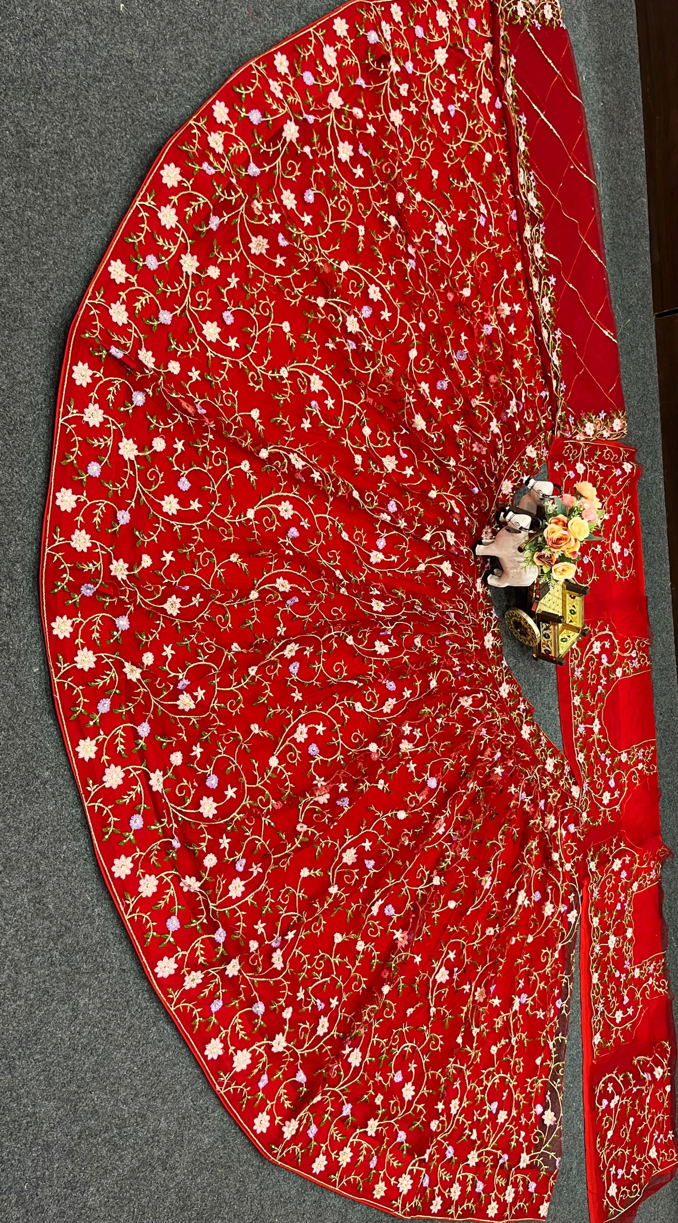 Red color soft net embroidered lehenga choli for women